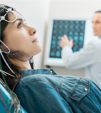 Woman with sensors on her head, receiving Neurofeedback Treatment in Washington IL