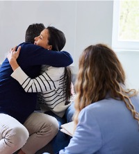 A happy couple hugging after a breakthrough with Marriage Counselors in Dunlap IL