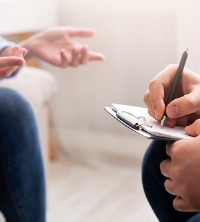 Client sitting down with counselor during General Counseling in Peoria IL