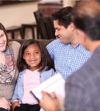 A happy family talking in Family Counseling in Peoria IL