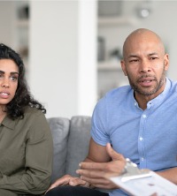 An unhappy couple discussing their relationship with Marriage Counselors in Washington IL