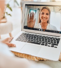 A woman talking on a computer with Marriage Counselors in Washington IL