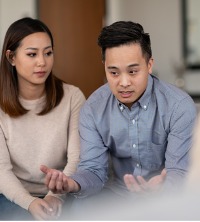 A man and woman discussing their troubles during Couples Therapy in East Peoria IL