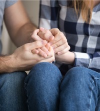 Two partners holding hands during Couples Therapy in Dunlap IL