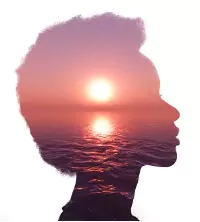 An illustration of a woman thinking about the sun on the water, trying to calm down after a Panic Attack