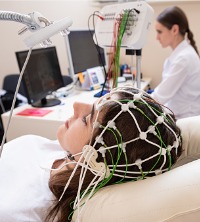 A woman with sensors on her head, undergoing Neurofeedback Treatment in Dunlap IL