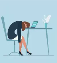 Woman putting her head down on her laptop, fighting work burnout