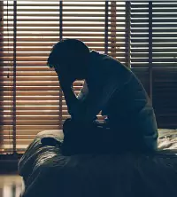 A man dealing with depression when waking up, needing Depression Counseling in Peoria IL