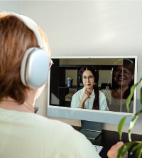 A woman talking with their counselor on their computer during Telehealth Therapy in East Peoria IL