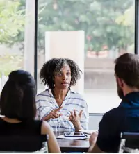 A counselor giving advice to a couple during Marriage Counseling in Washington IL