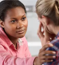 A counselor comforting a client during Depression Treatment in East Peoria IL