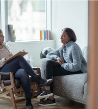 A woman struggling with her emotions and talking with a counselor during Depression Therapy in East Peoria IL